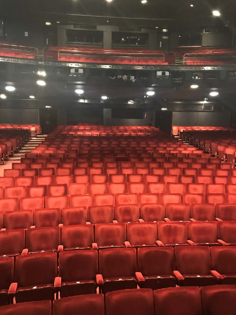 A picture of the red auditorium seats in the Peacock Theatre 