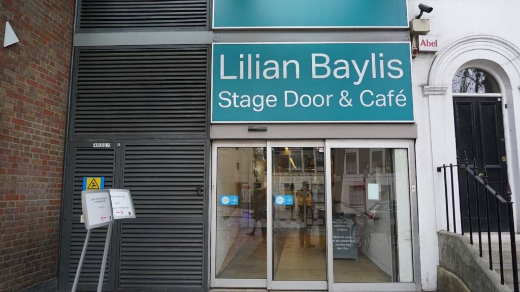 The entrance to the stage door of Sadler's Wells Theatre with automatic glass doors